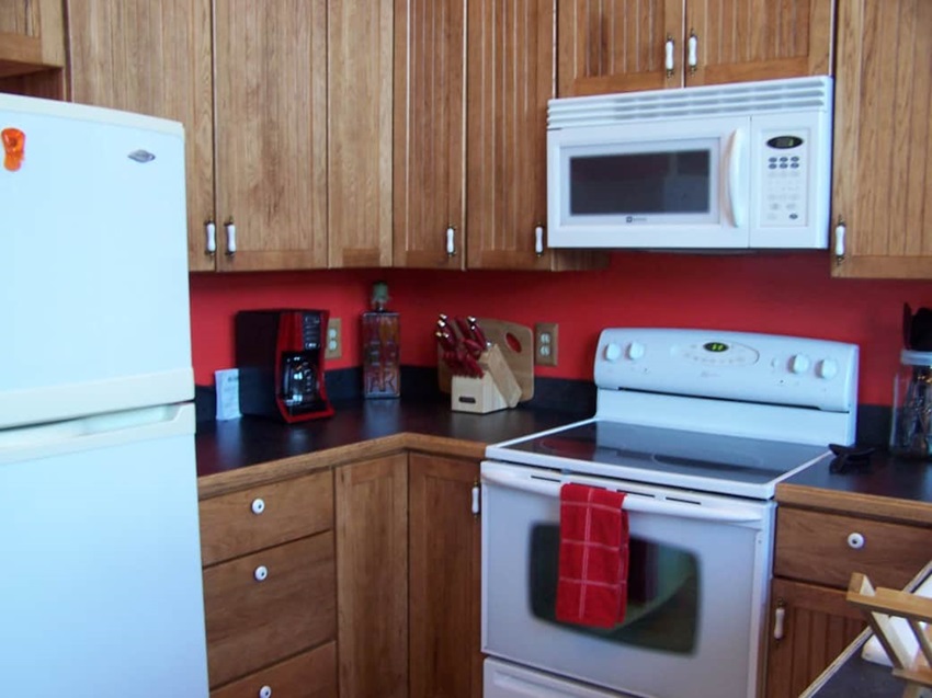 Kitchen Appliances And Wooden Cabinets